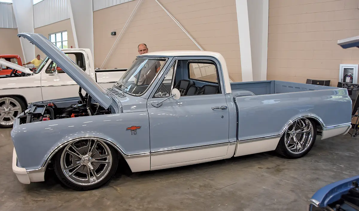 light blue and white 1967 Chevrolet C10, cleanly restored with a lowered stance and polished wheels
