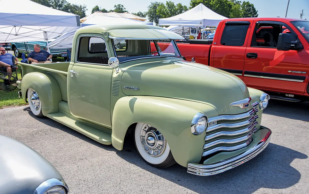 1949 Chevrolet 3100 pickup in pastel green with a custom visor and a lowered stance