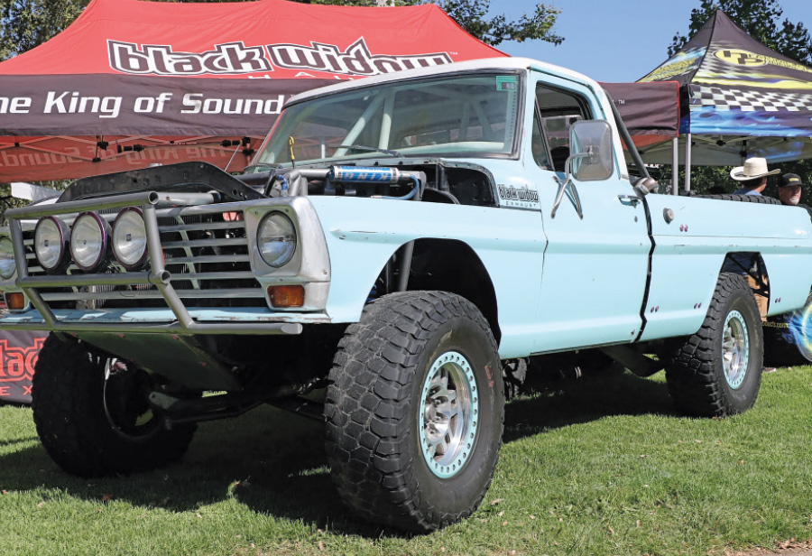 Custom off-road 1967 Ford F100 with a light bar and lifted suspension