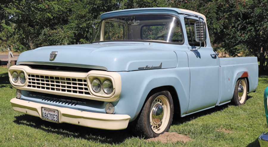 Light blue 1959 Ford F100 with cream accents and vintage wheels