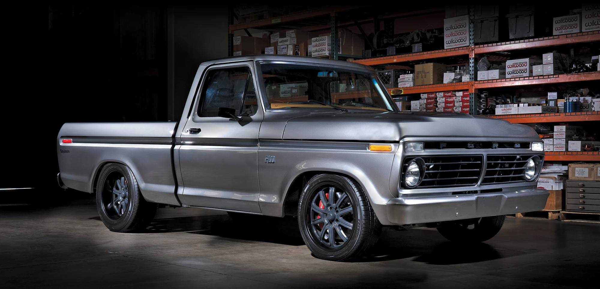 Custom 1974 Ford F-100 in silver with Wilwood brakes and a lowered suspension for a sleek stance