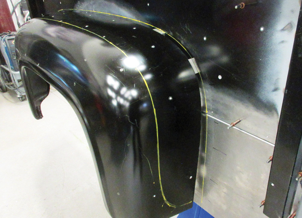 Test-fitting the outer fender on the custom F-100 bed structure