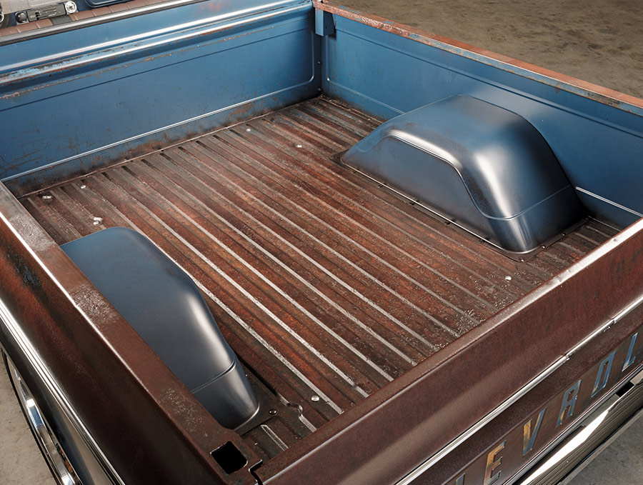 Bed of 1969 Chevy C10, patina finish with metal wheel wells