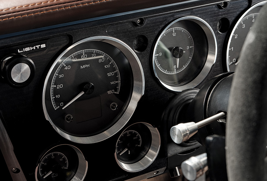 Close-up of gauge cluster in 1969 Chevy C10 with custom speedometer and tachometer