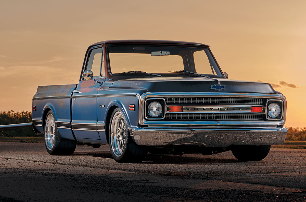 1969 Chevy C10 rear view with patina finish, parked near airport