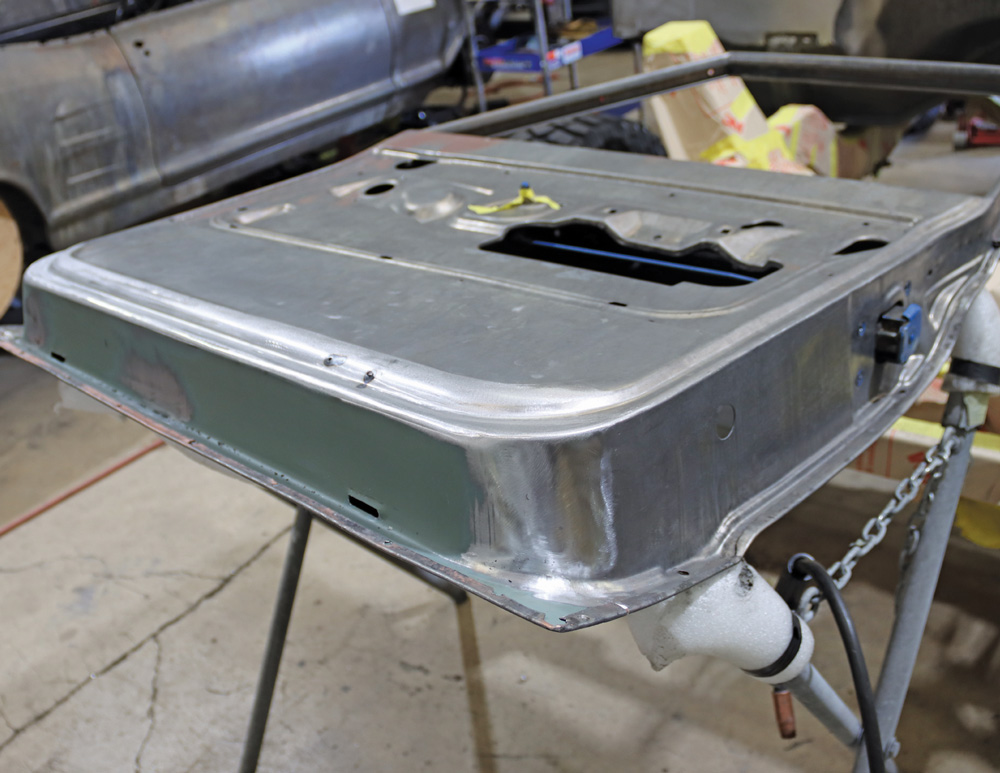 Restored door skin of a Chevy K10, stripped and prepped for further bodywork and finishing