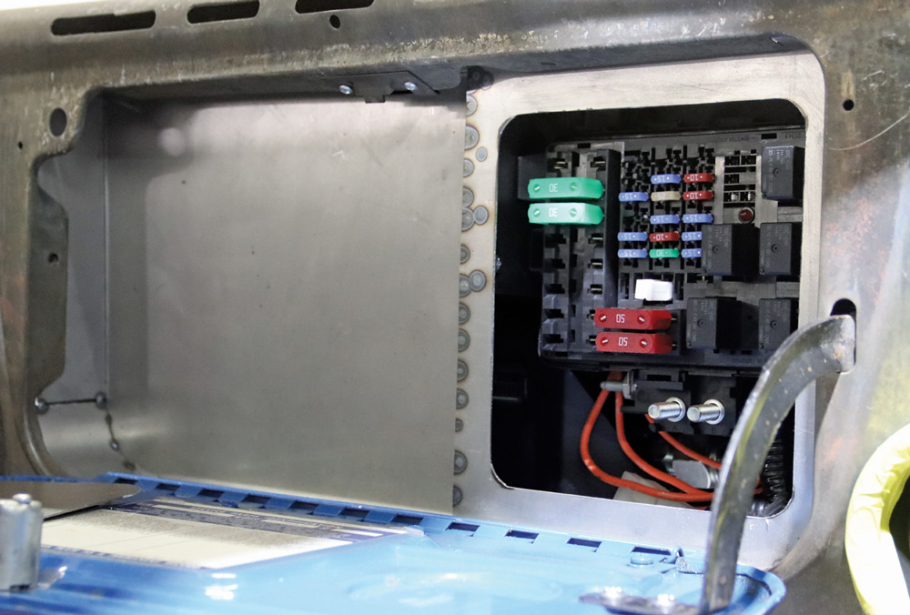 Interior fuse box installation on a Chevy K10 with custom wiring and fabrication