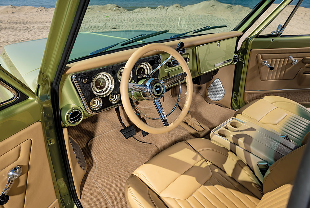 interior of K5 Blazer, tan upholstery, classic dashboard, beach in background