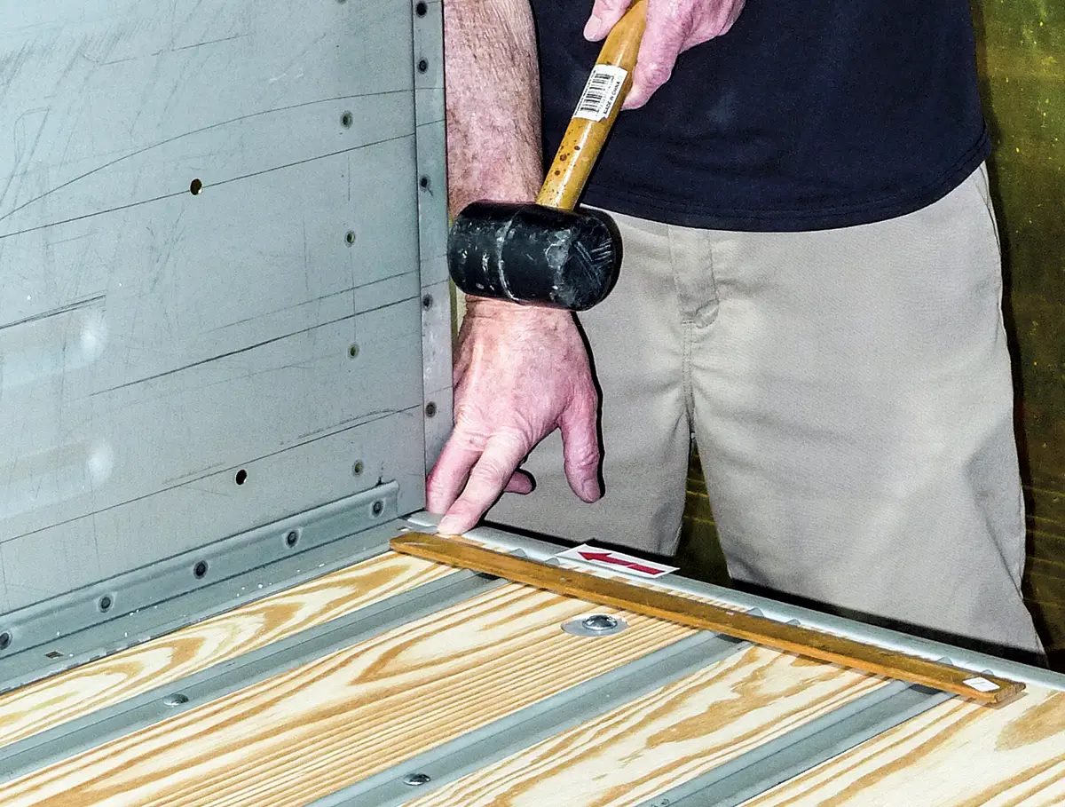 Adjusting bed rail alignment with a rubber mallet for final fitment