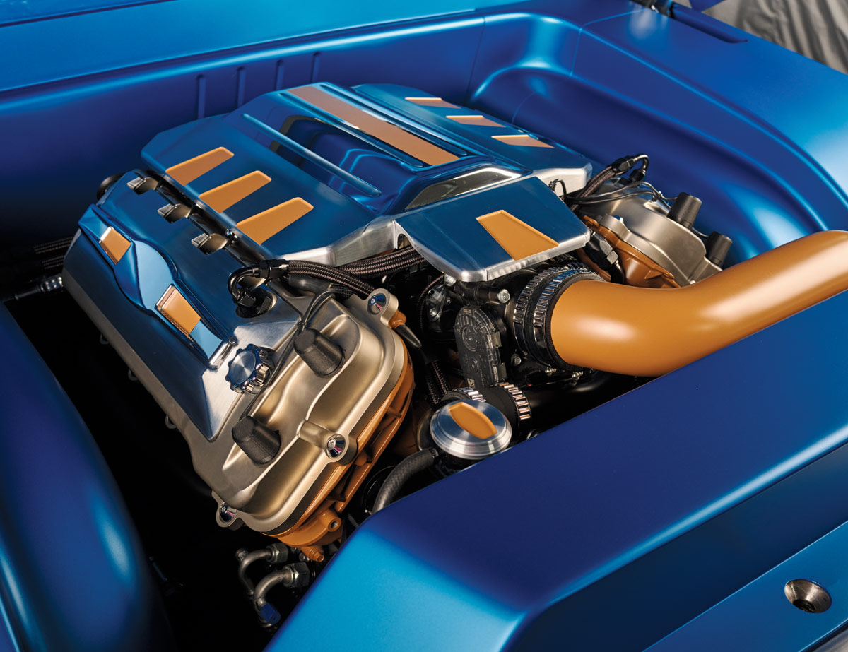 Close-up of highly detailed engine bay in 1969 Ford F-100, featuring blue and copper highlights