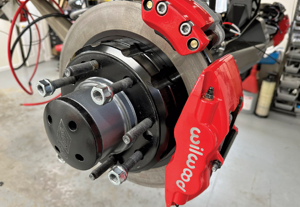 Front brake assembly on GMC K2500 with Wilwood calipers, highlighting precision and stopping power