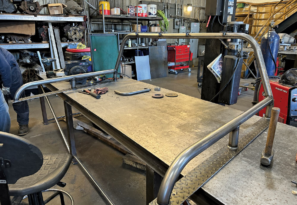 Custom-built steel roll bar for GMC K2500, fabricated in a shop environment for added protection