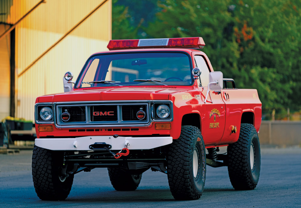 Completed 1979 GMC K2500 “Brush 101” fire truck, restored with rugged off-road tires and vintage fire department decals