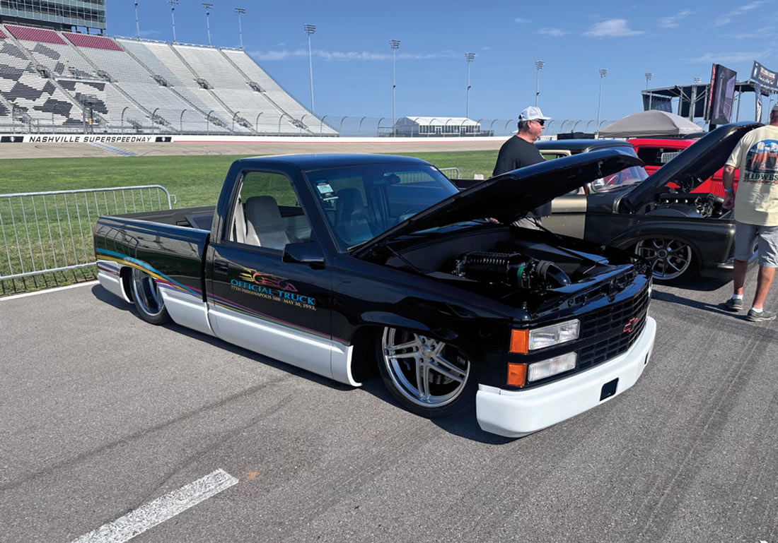 custom 1993 Chevrolet 454 SS pickup with lowered stance and Official Truck Indy 500 graphics, displayed at Nashville Superspeedway