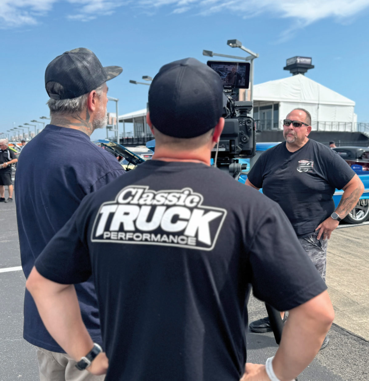 Classic Truck Performance crew films a segment at the show, capturing the action among custom trucks and enthusiasts