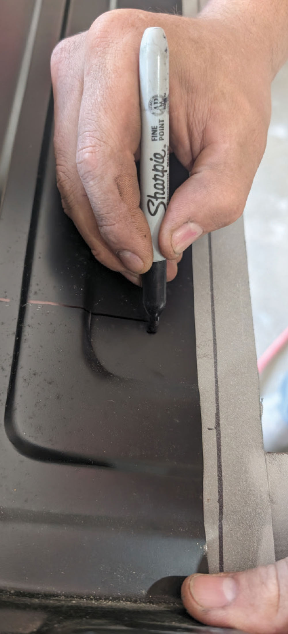Marking precise alignment lines on black replacement panel for 1966 Chevy truck door
