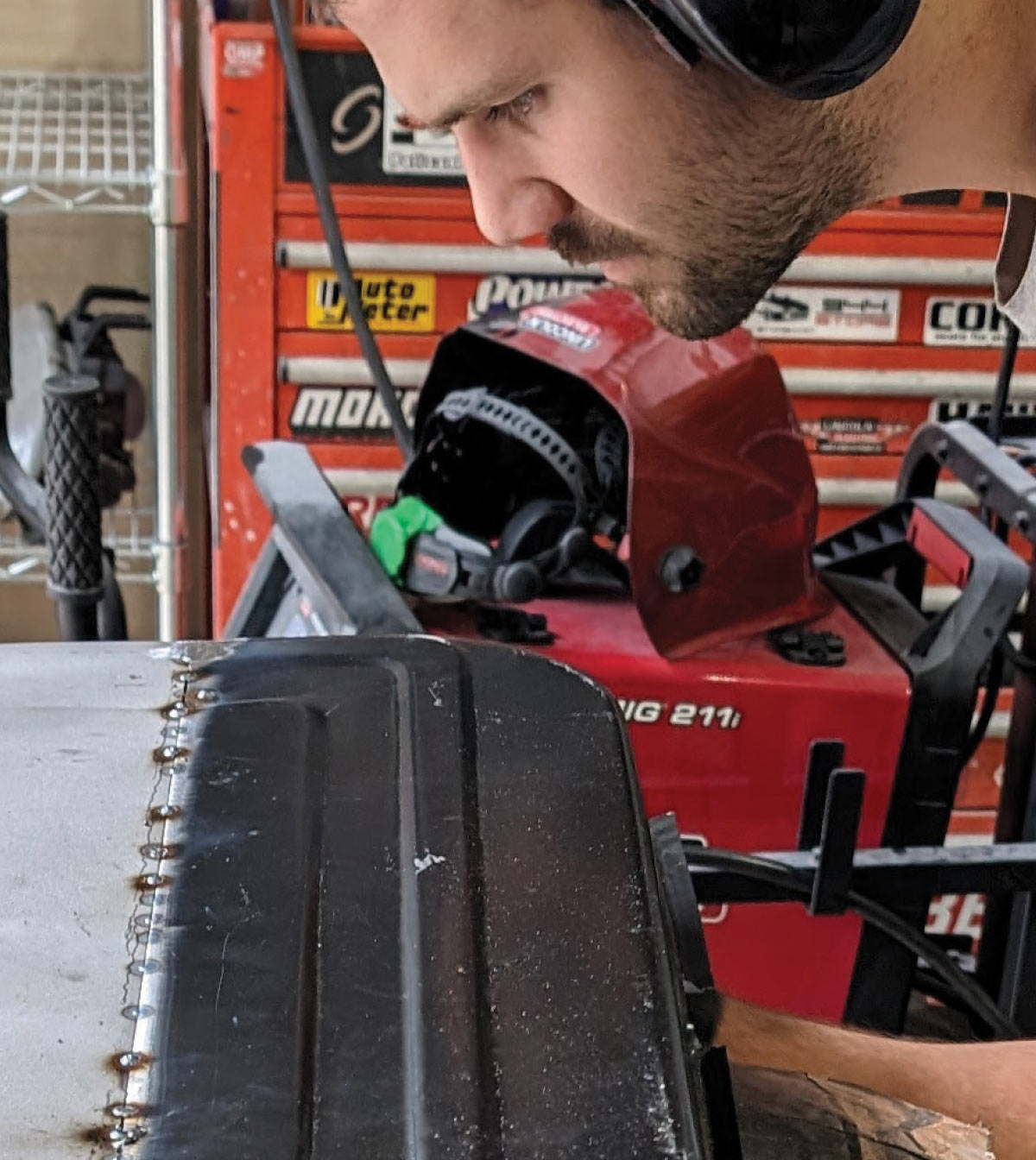 Stitch welds along replacement panel seam on 1966 Chevy truck door restoration