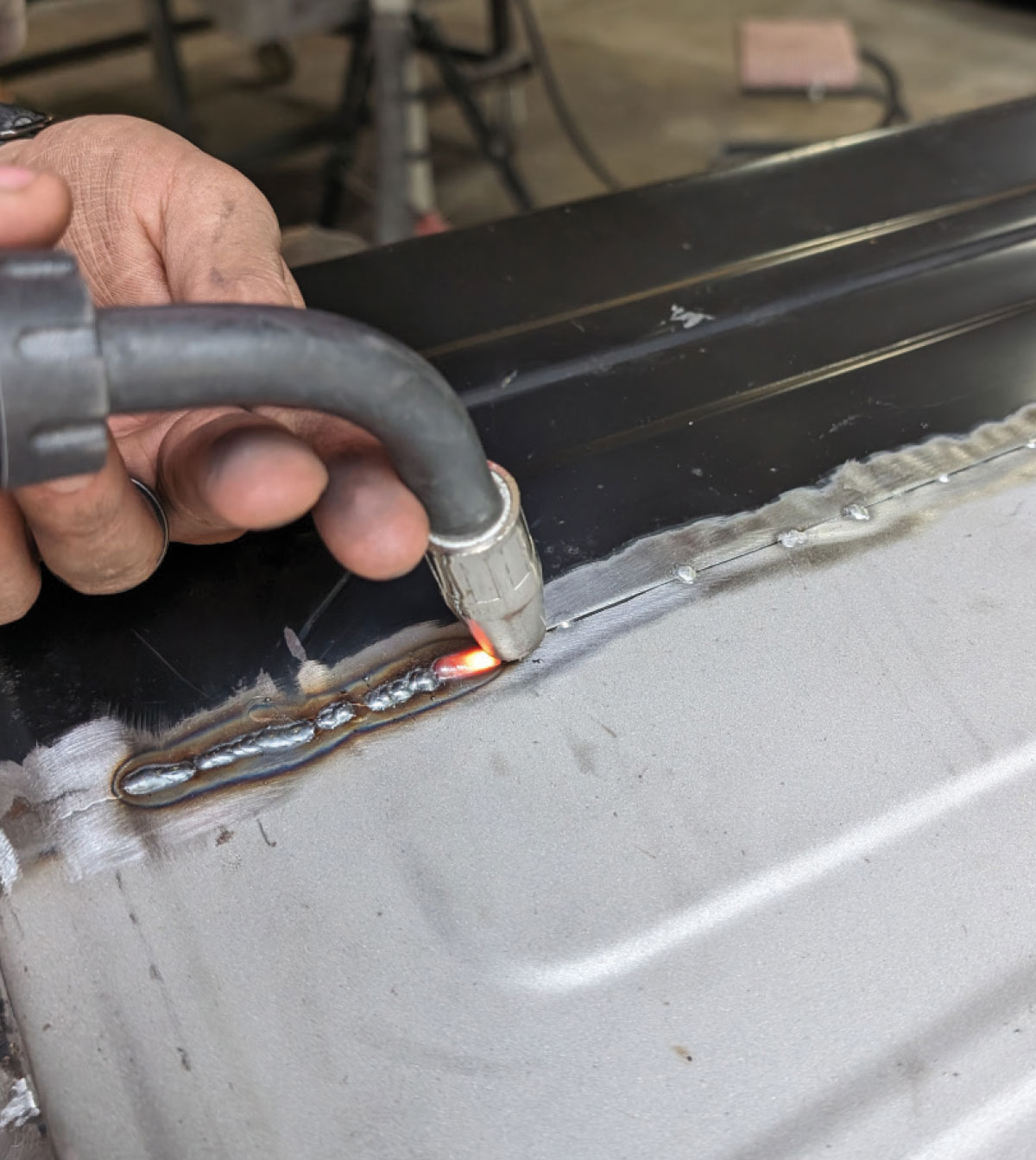 MIG welding full seam on 1966 Chevy truck door replacement panel