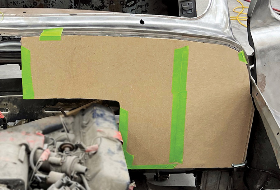 Cardboard template firewall shaping green tape vintage car engine bay fabrication process