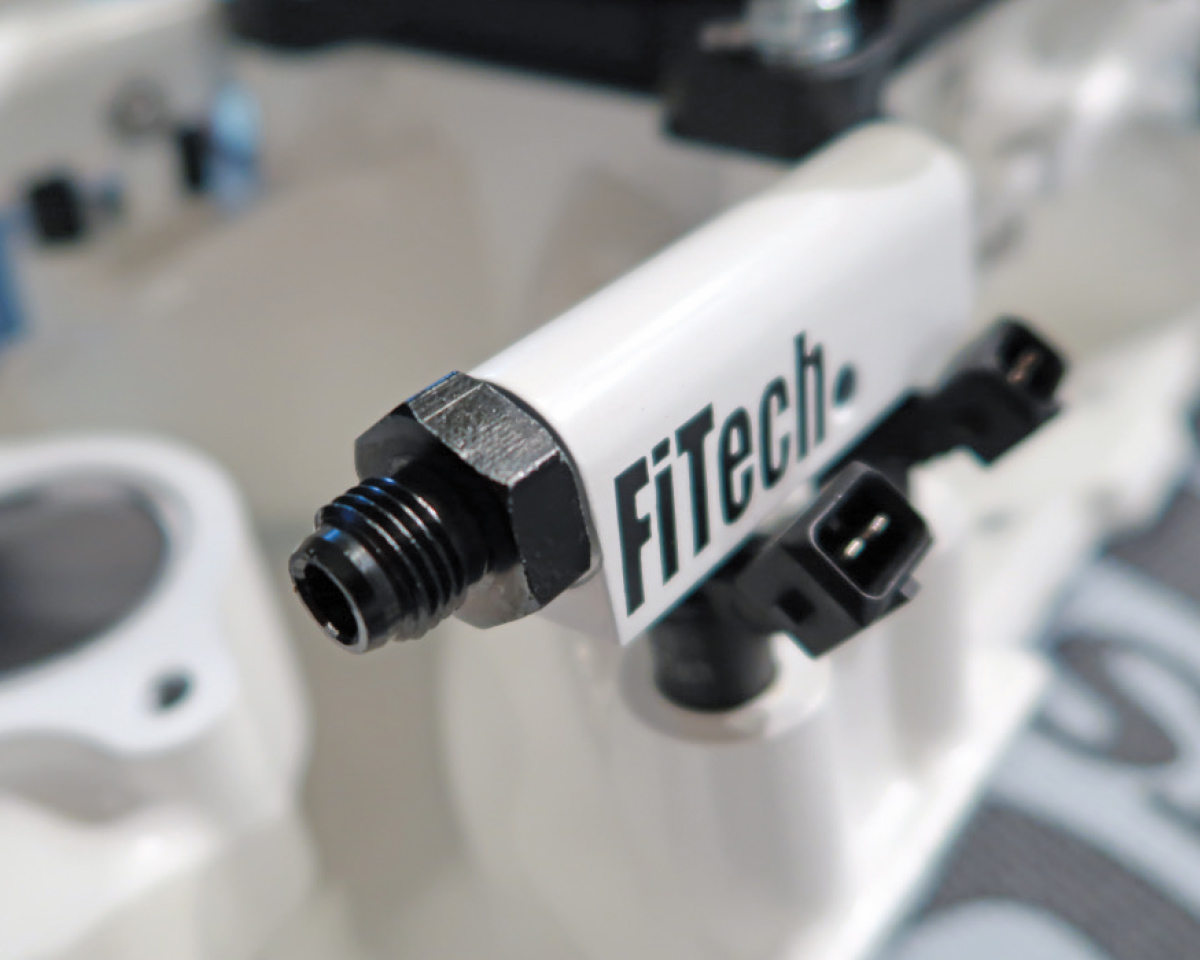 FiTech fuel rail fitting showcasing durable construction for high-pressure fuel system connections