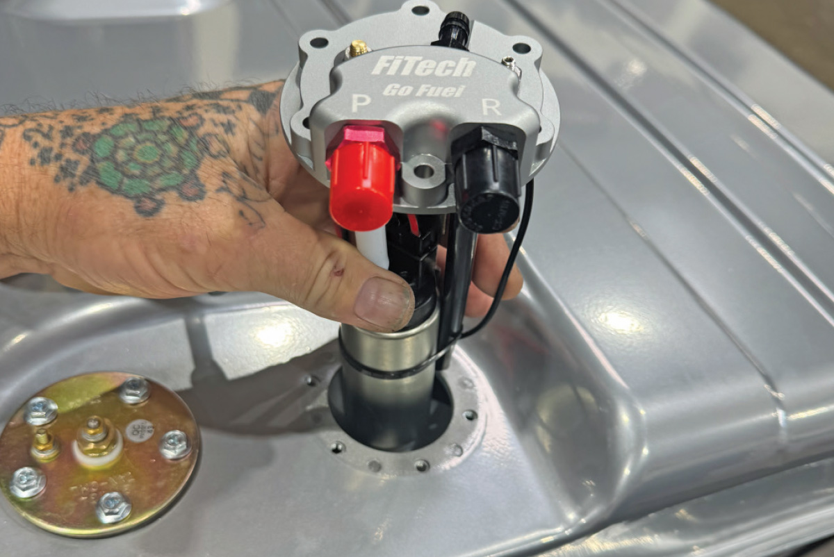 FiTech Go Fuel in-tank pump system shown during installation on a custom fuel tank