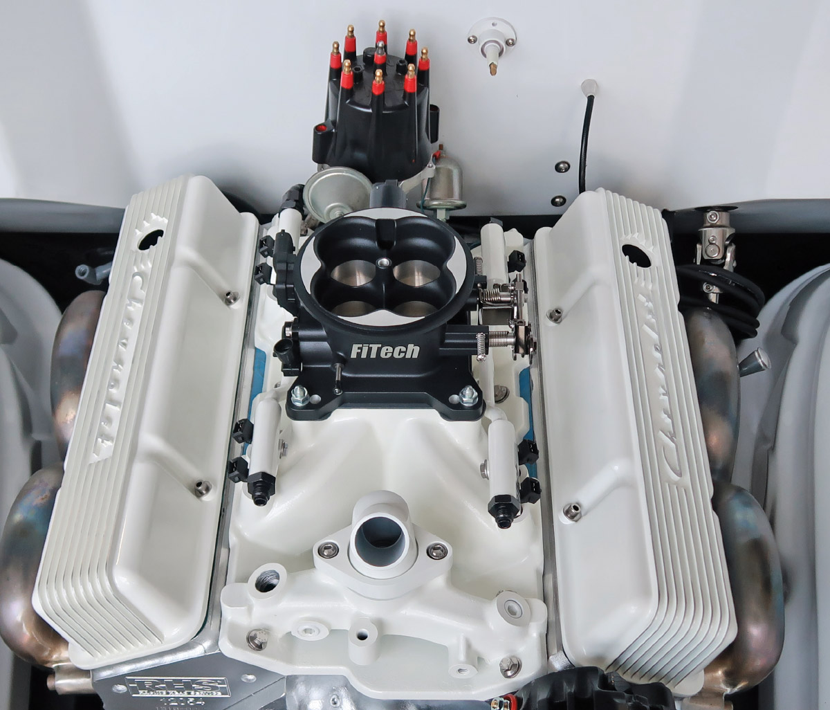 Fully assembled engine bay with FiTech EFI system and custom valve covers installed for a clean finish