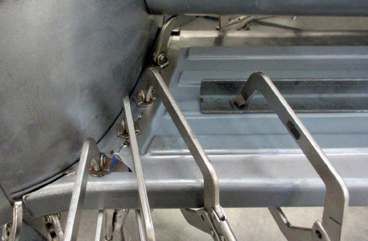 Ford F100 running board clamped to cab corner for alignment
