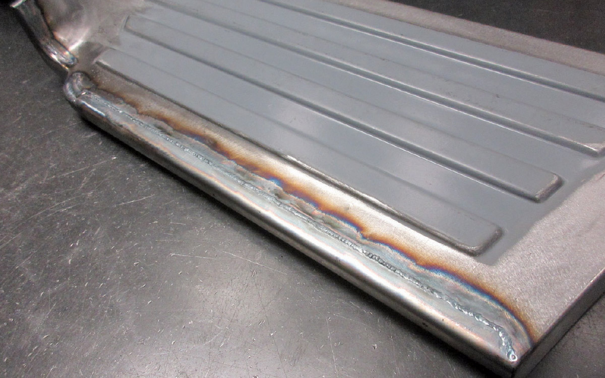 Ford F100 running board welding with visible heat marks