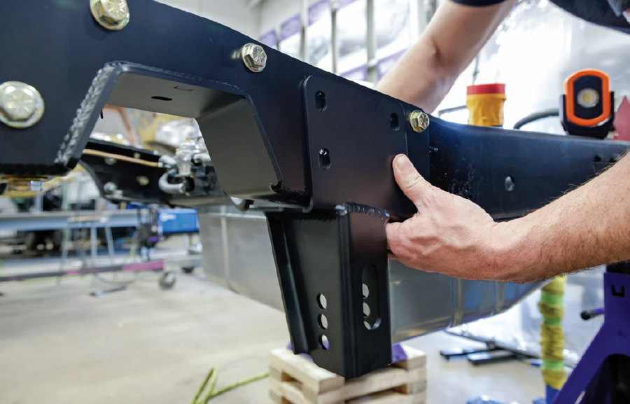 aligning and bolting rear suspension bracket on C10 frame Quadralink installation step-by-step