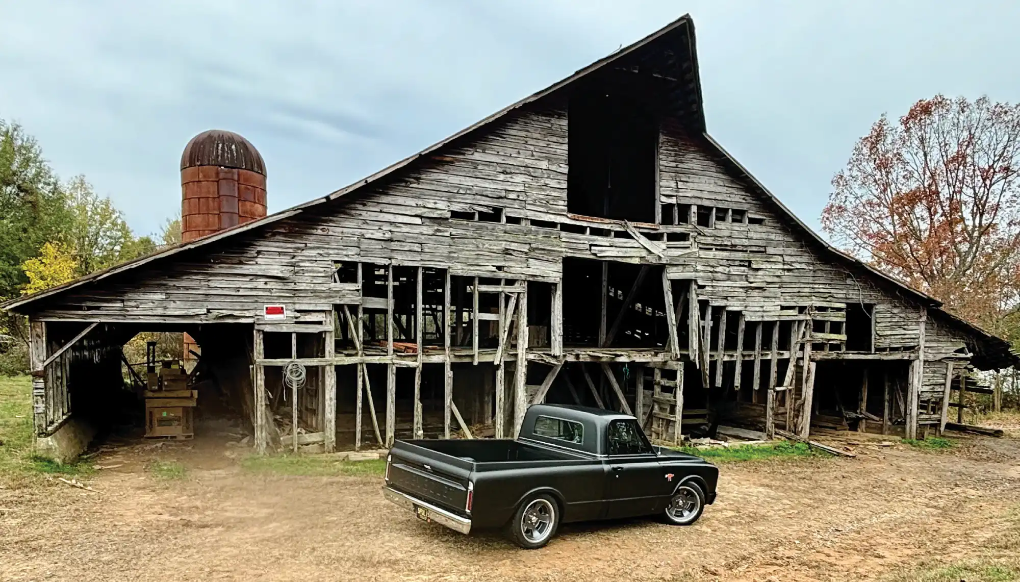 1969 Chevrolet C10 truck matte black barn find rustic backdrop classic pickup vintage Chevy