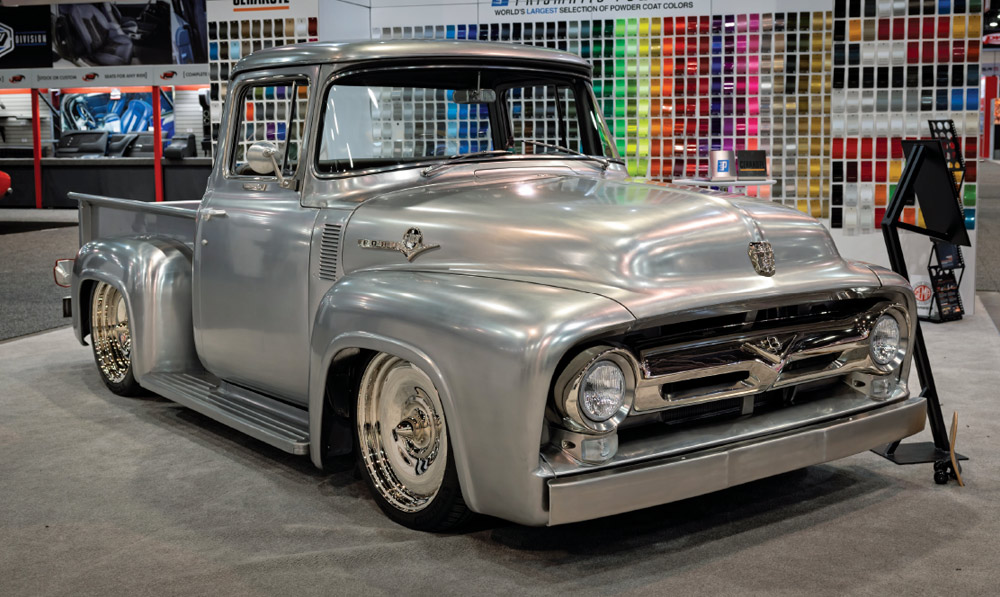 1956 Ford F100 polished silver custom at SEMA 2024 featuring chrome accents and slammed stance