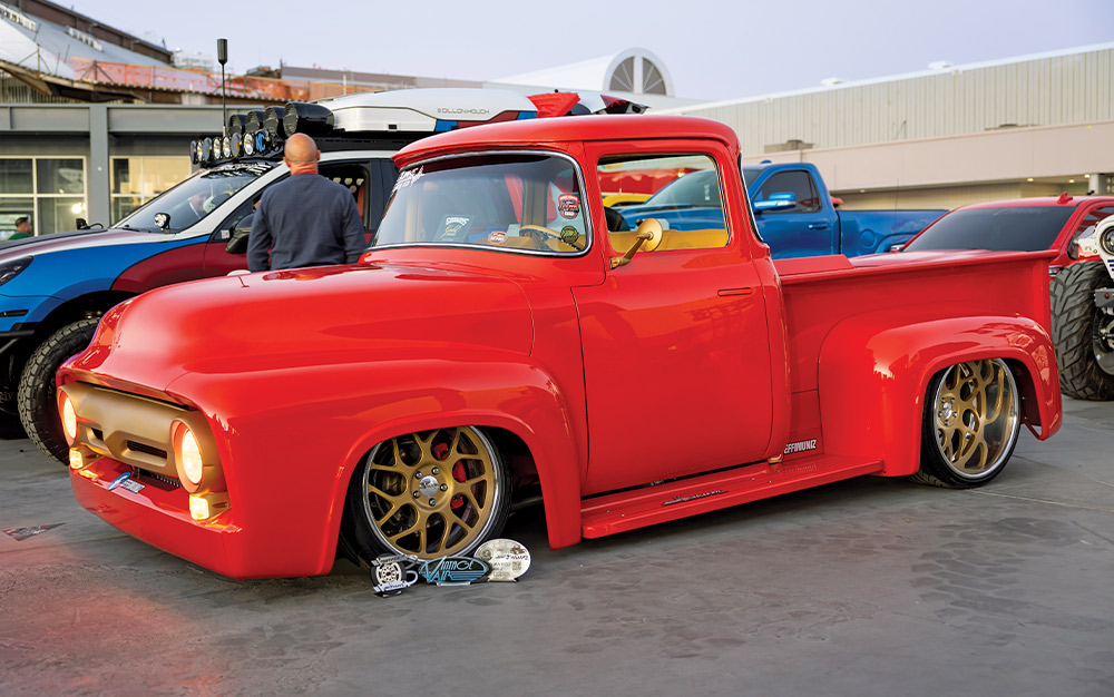 1955 Ford F100 red gold wheels slammed truck SEMA 2024
