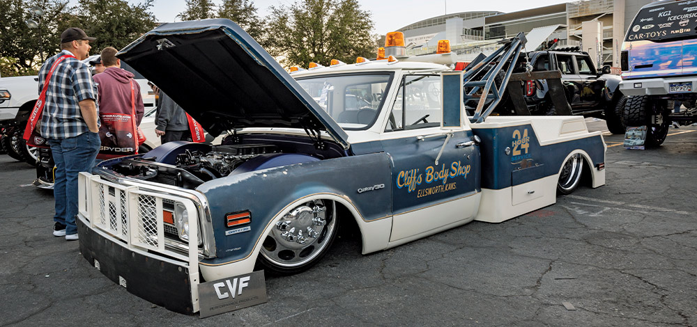 custom Chevy C30 tow truck with patina finish and slammed stance, Cliff's Body Shop branding, SEMA 2024