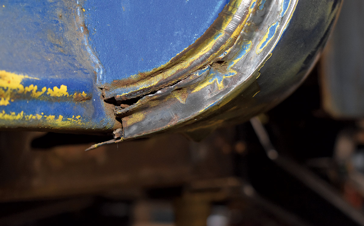 Close-up of corroded and split metal on the truck's cab