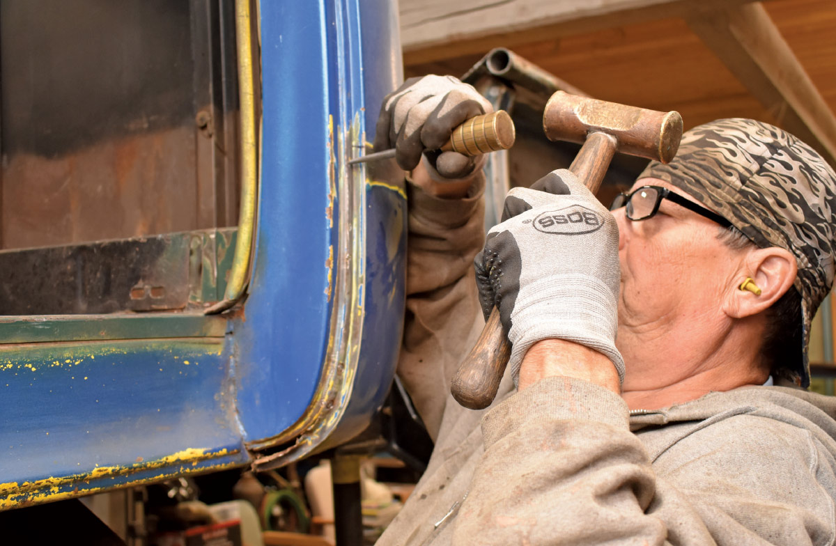 Metalwork adjustments being made to fit the new panel properly