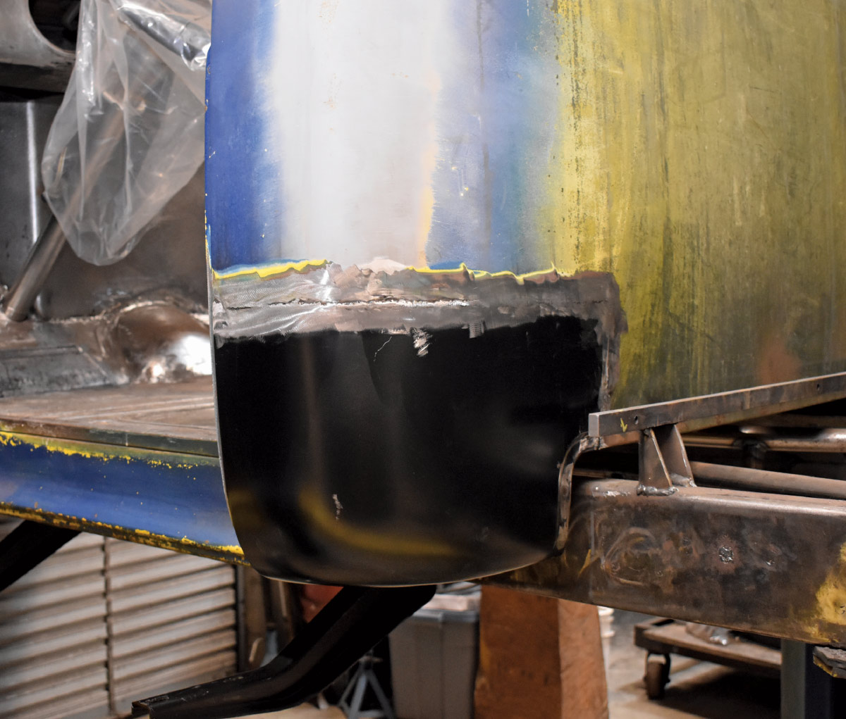 Fully welded and smoothed replacement cab corner installed on a classic truck