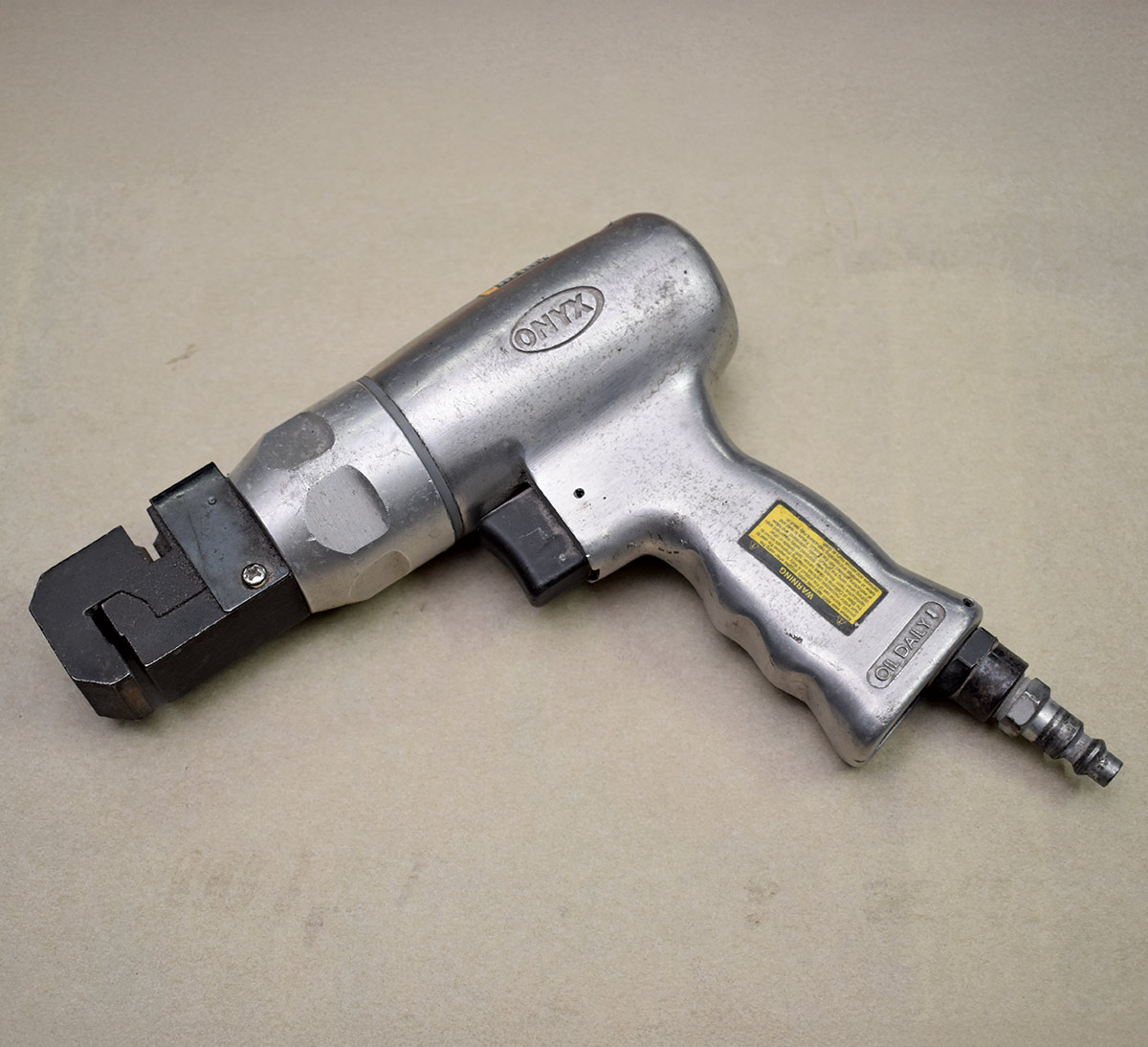 ONYX brand pneumatic flange tool used for panel fitting and metal shaping