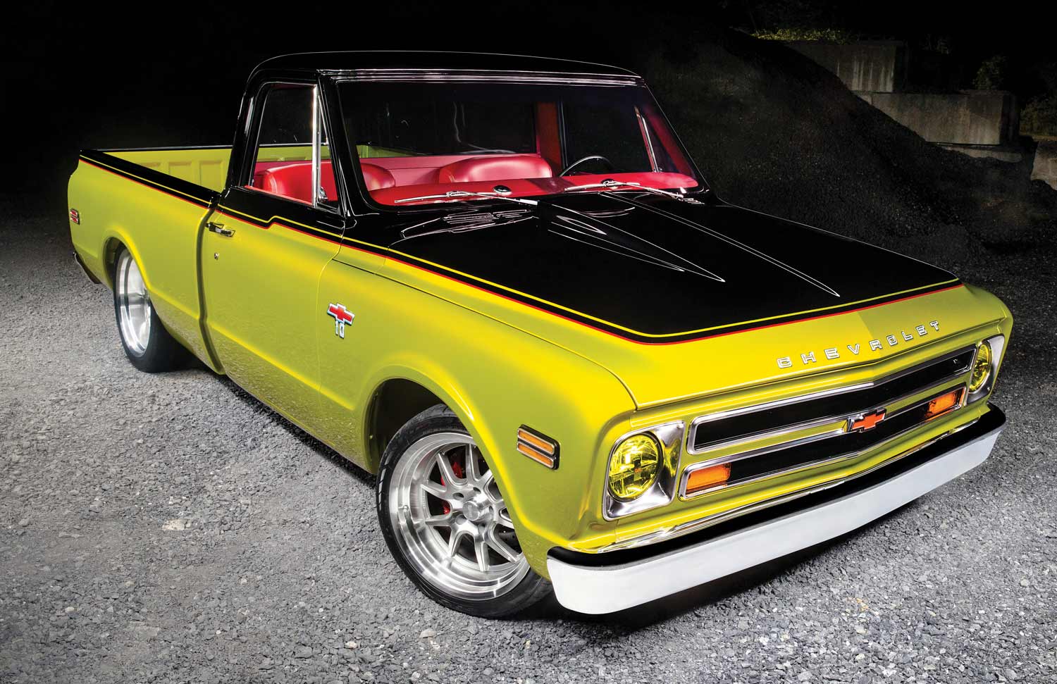 1968 Chevrolet C10 aggressive stance with modern wheels and red interior