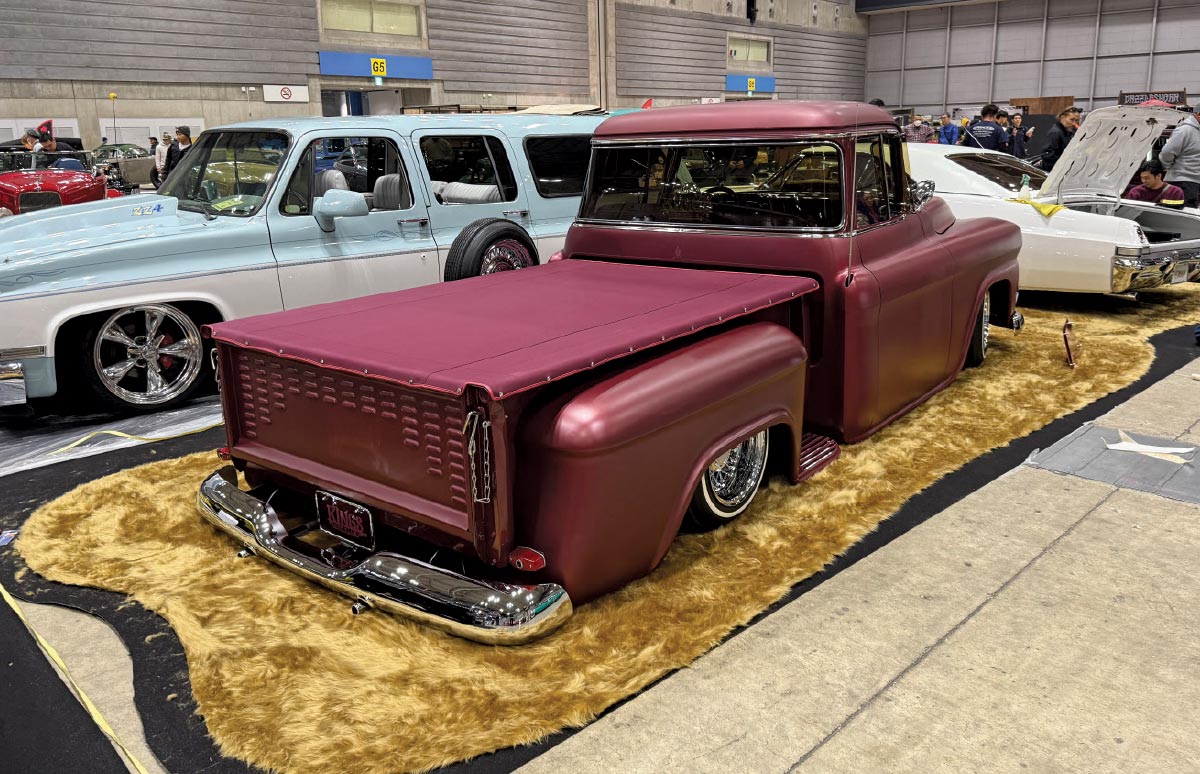 1956 Ford F100 – Satin burgundy, custom bed cover, and chrome details