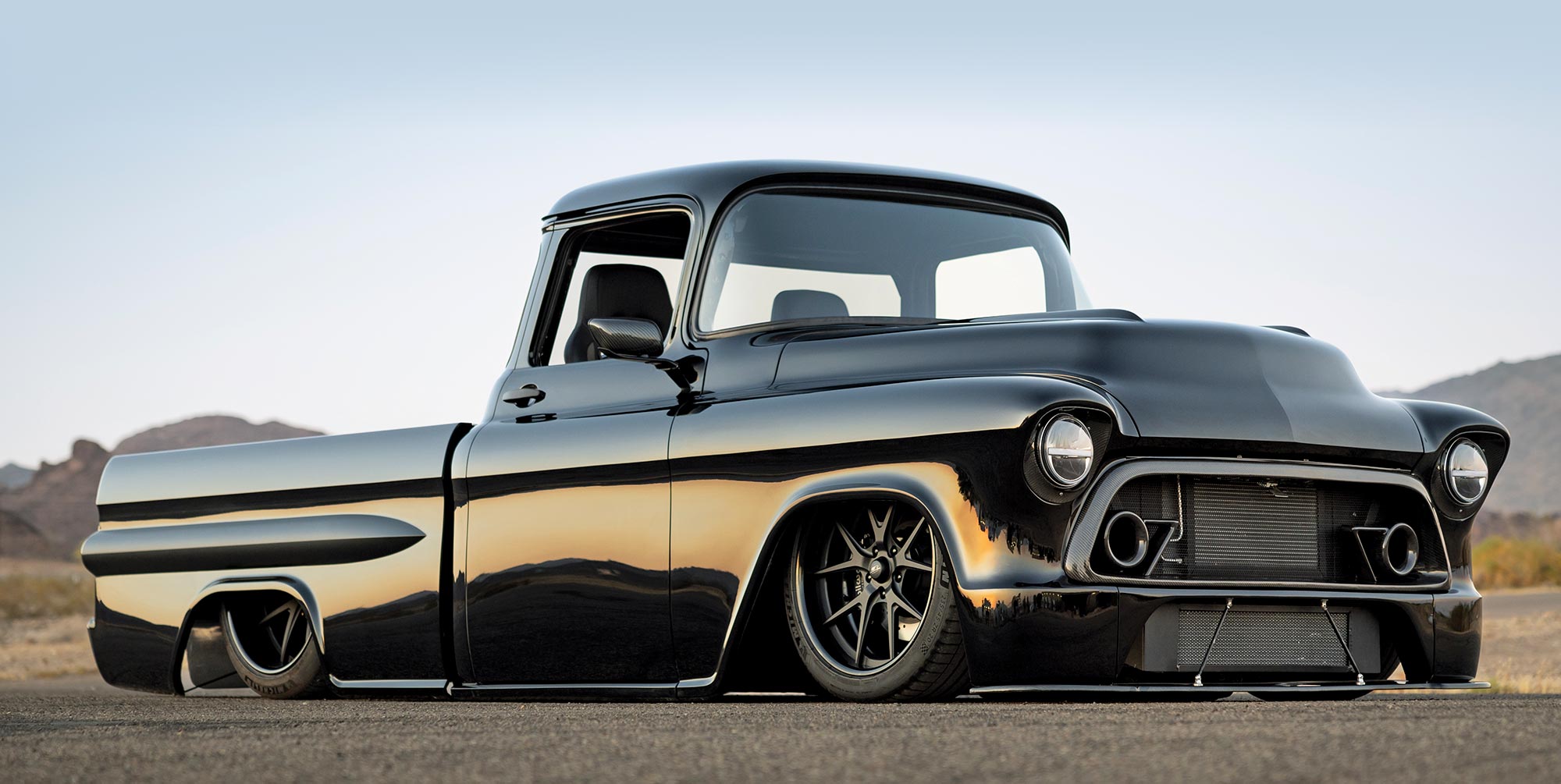 1957 Chevy pickup slammed deep-dish wheels race-inspired front grille pro-touring build