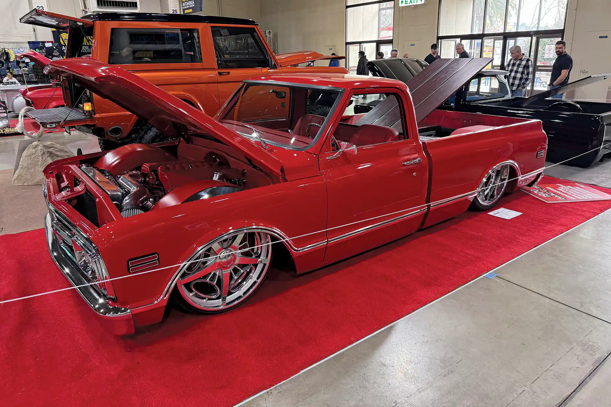 Red truck parked with hood open