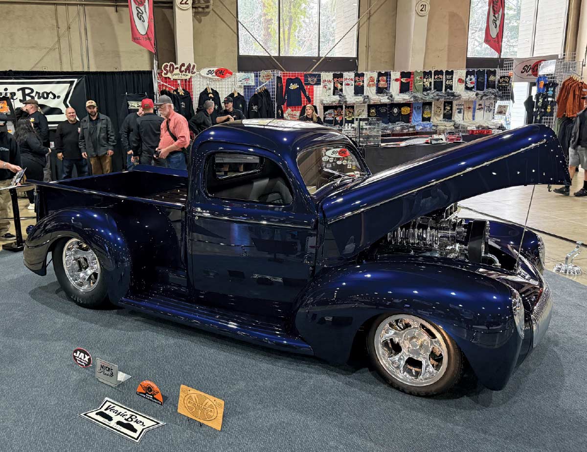 dark blue pickup truck with hood open