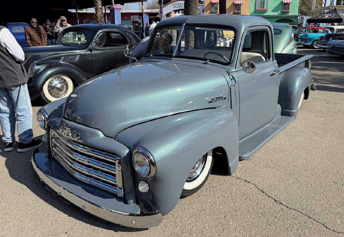 3/4 front view of faded blue truck