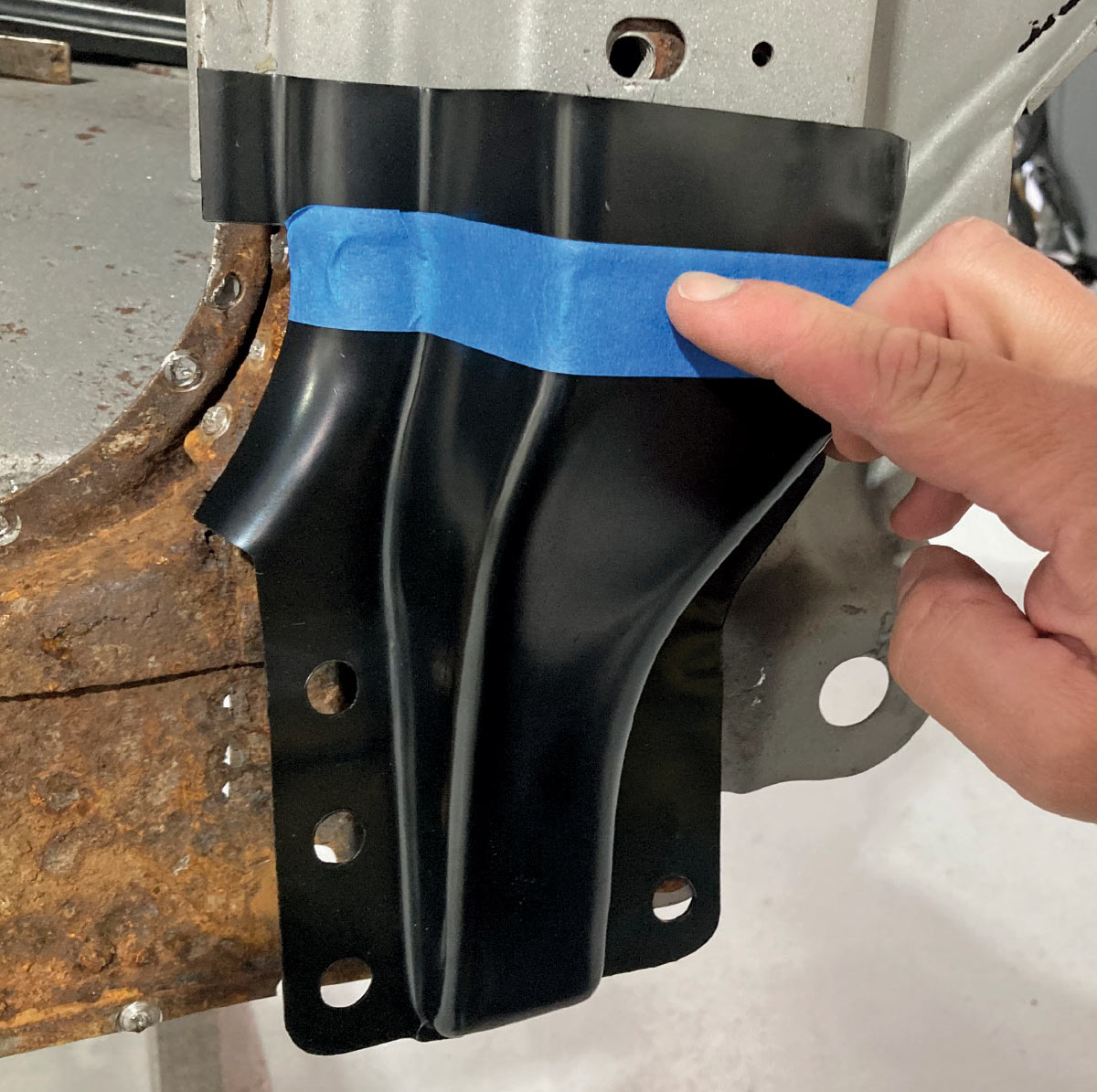Test fitting a new lower A-pillar patch panel before welding