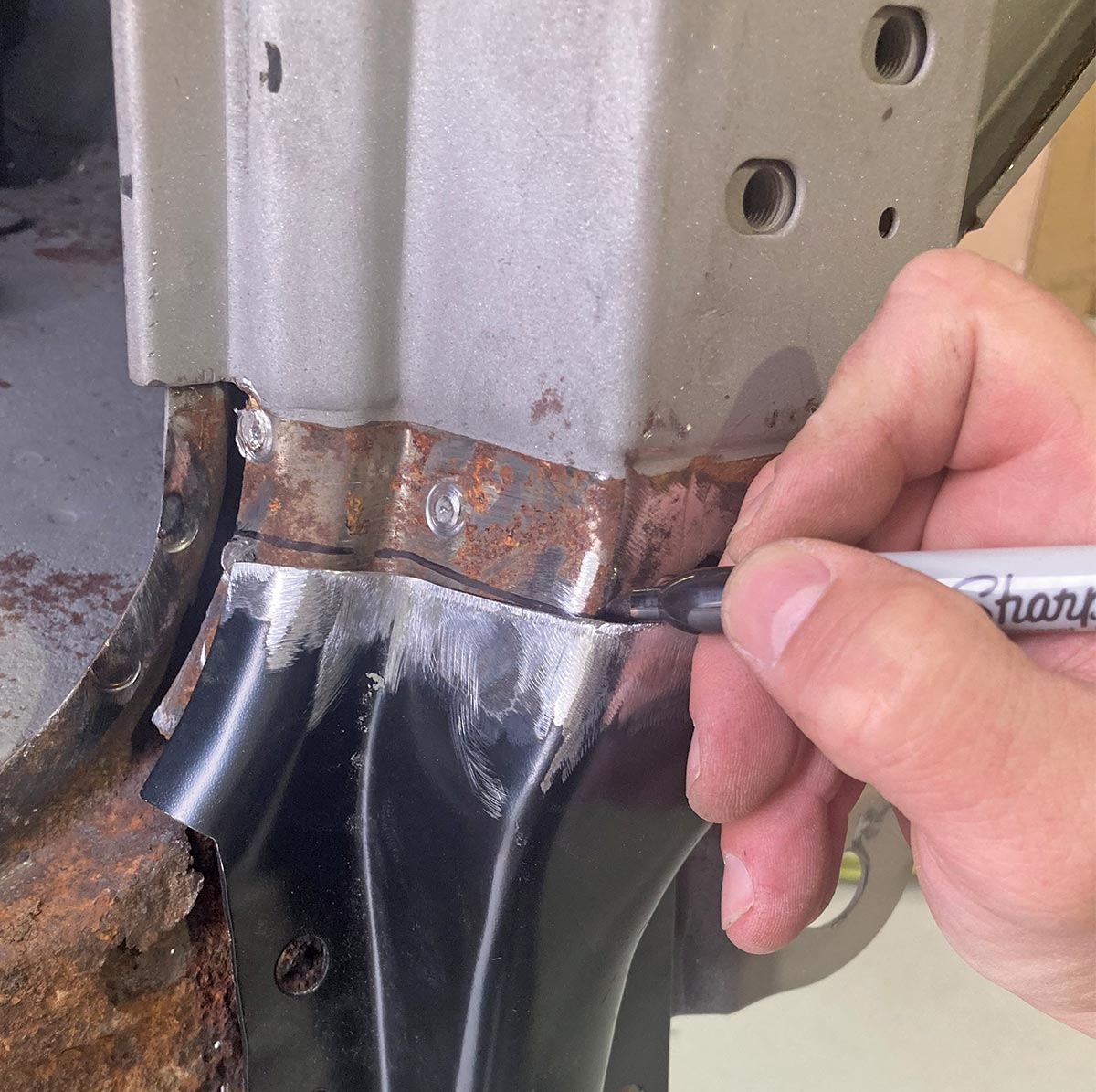 Marking the cut line for precise trimming of the replacement panel