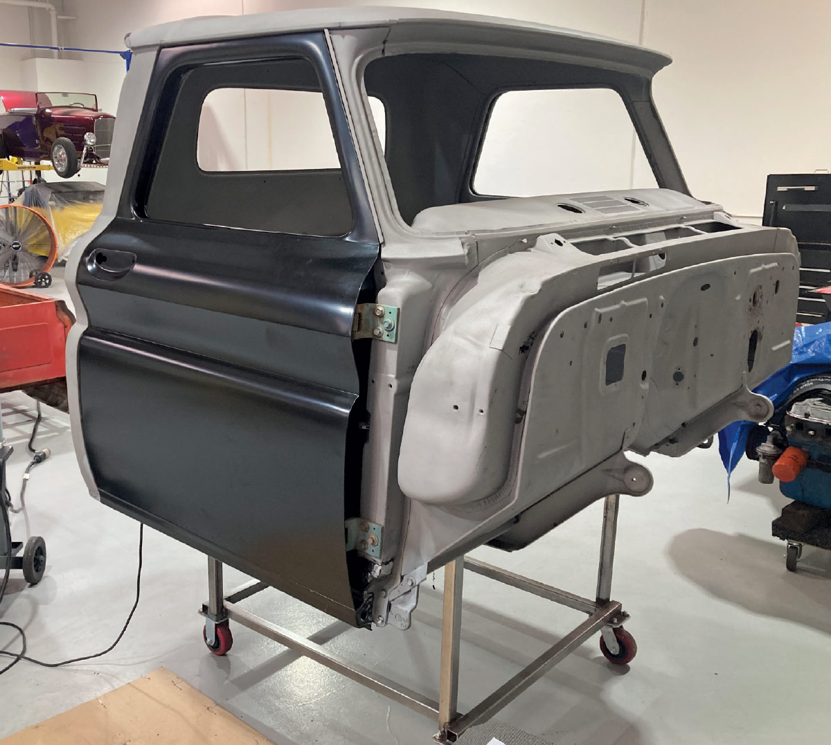 Restored cab assembly with doors test-fitted for proper alignment