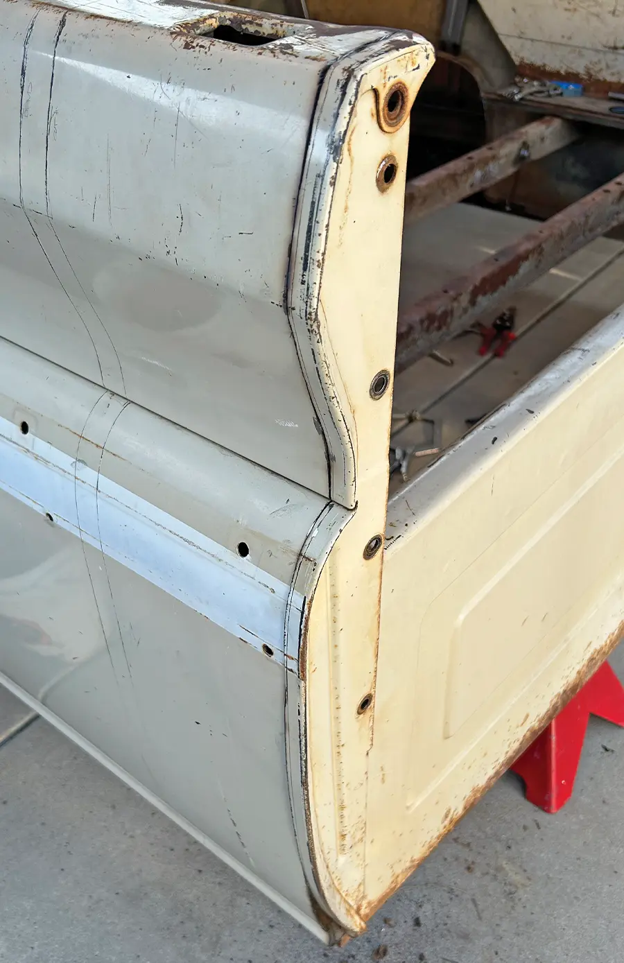 The truck bed side panel prepped and placed on jack stands for repair
