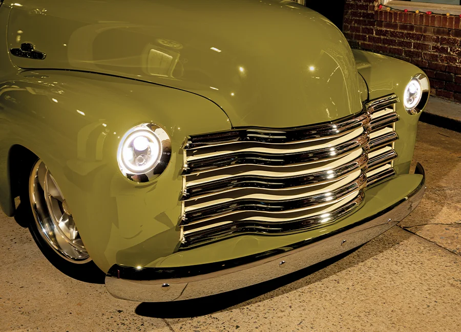 1952 Chevrolet 3100 front end with a chrome five-bar grille, LED halo headlights, and flawless olive-green paint
