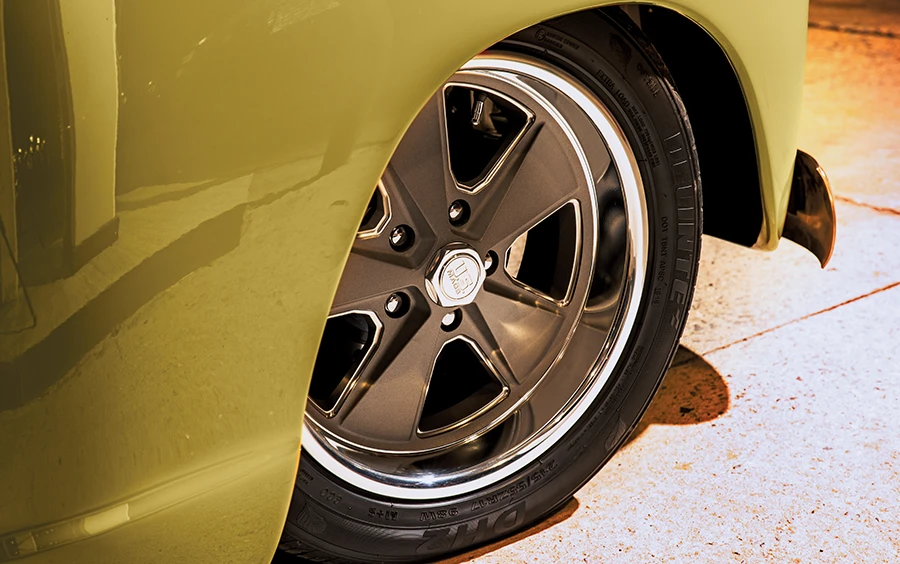 1952 Chevrolet 3100 close-up of custom bronze multi-spoke wheels wrapped in high-performance tires