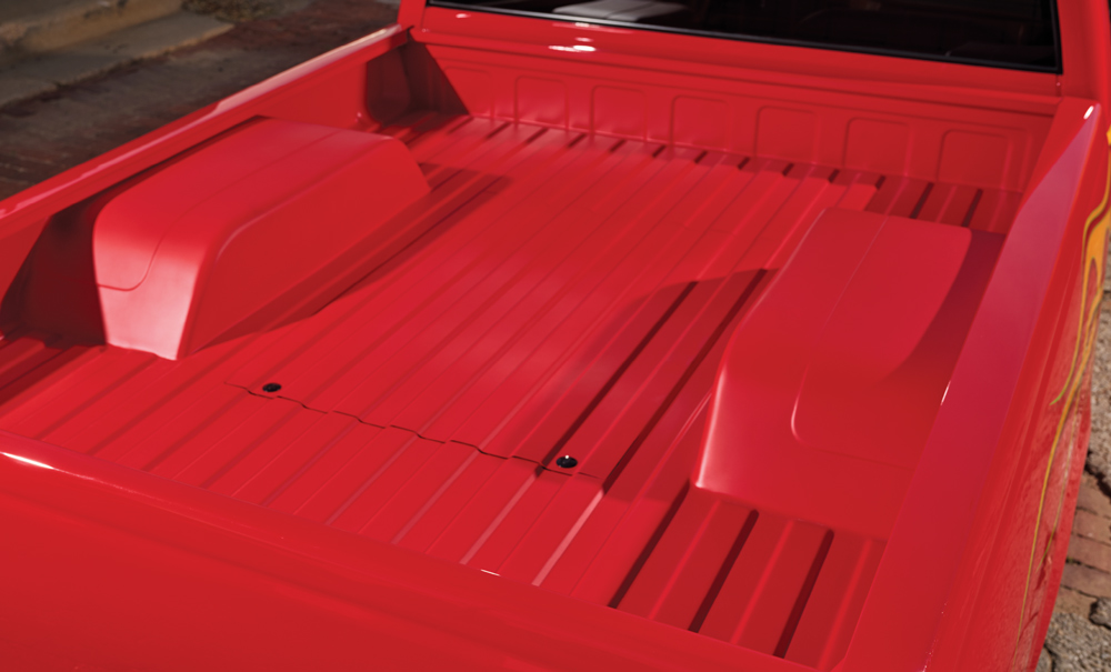 1996 Chevy truck bed features a smoothed and painted sheet metal tub and notch cover